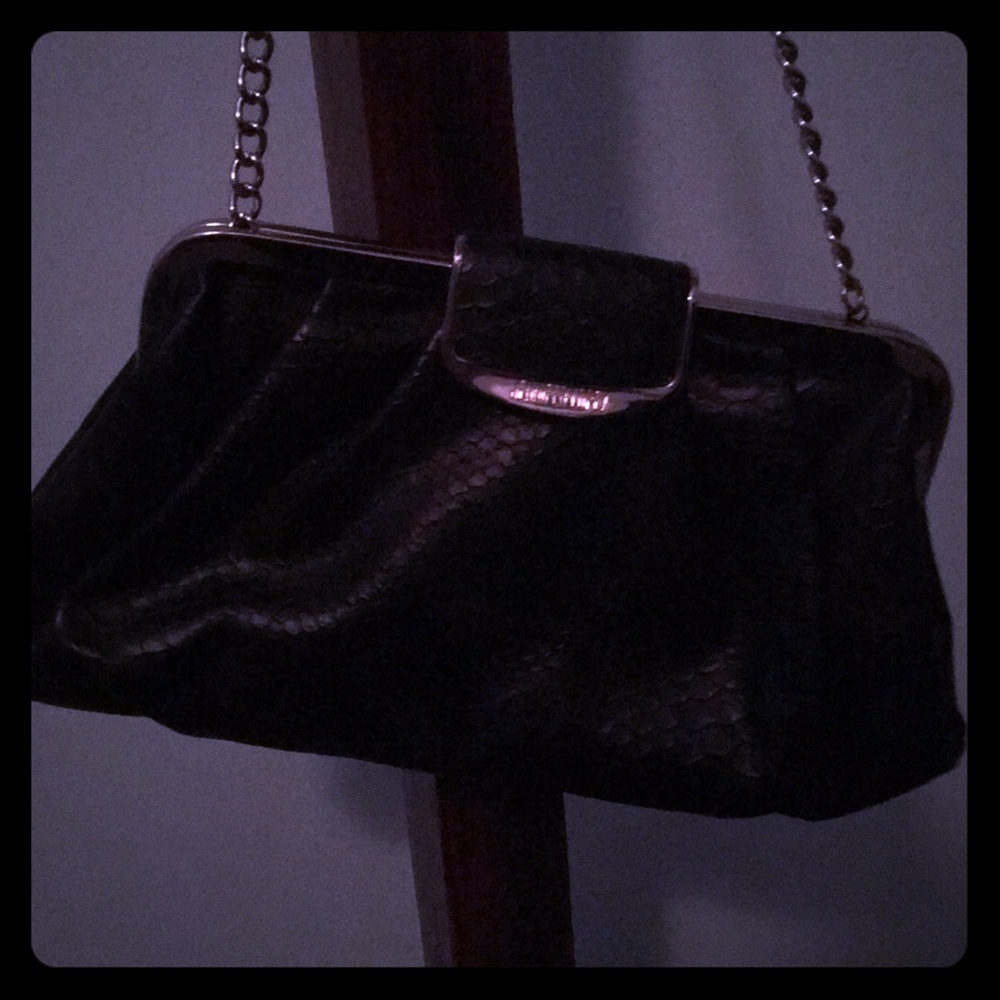 Black clutch with a silver strap